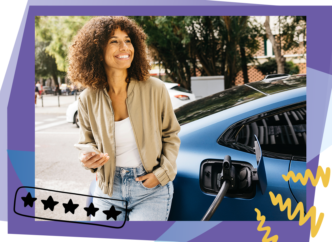 an ev driver smiling while charging her vehicle
